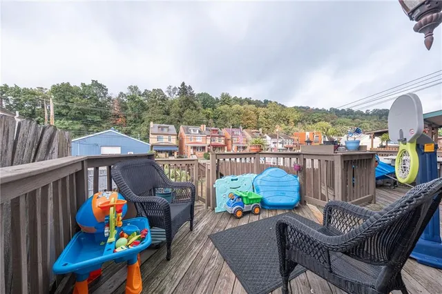 a view of a balcony with city