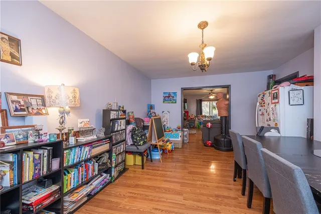a living room with lots of furniture and a book shelf