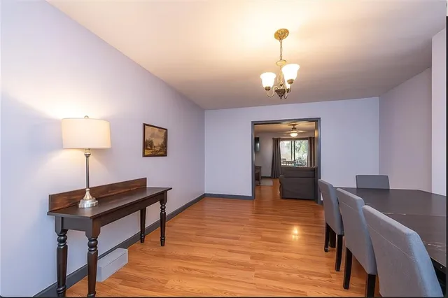 a view of a livingroom with furniture wooden floor and a window