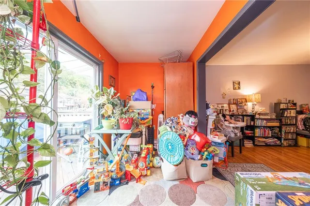 a bedroom with furniture and a rug