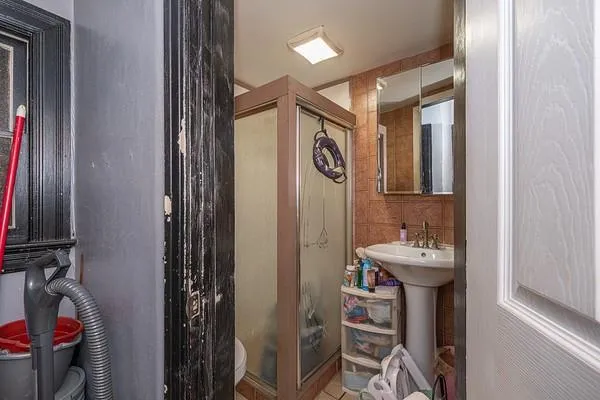 a bedroom with bed and a window