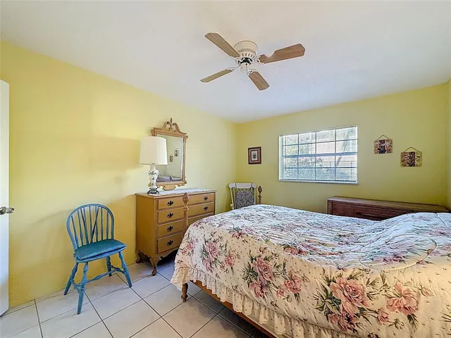 a bedroom with a bed and dresser
