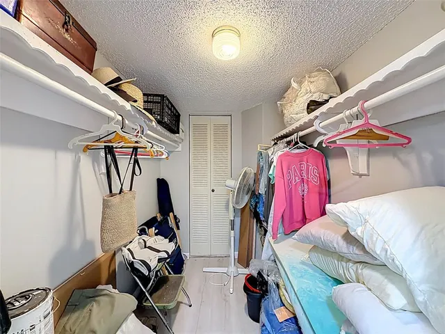 a bathroom with a double vanity sink toilet and shower