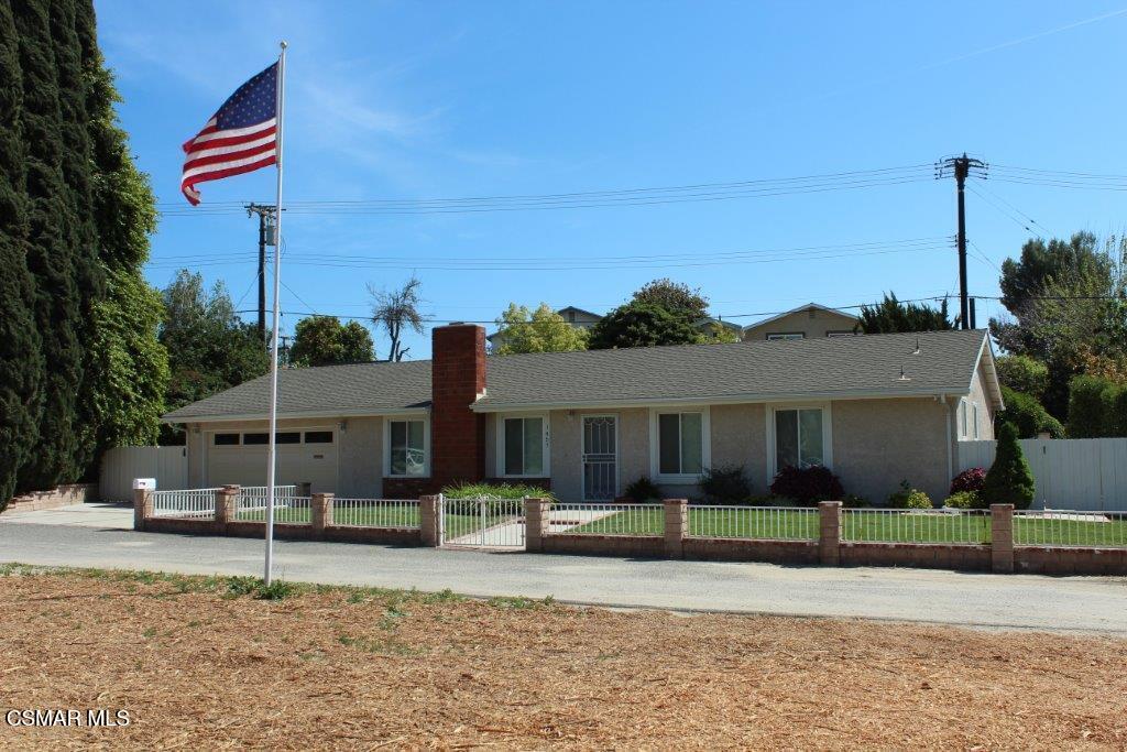 a house that has a tree in front of it