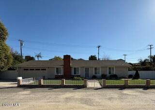 1457 Sycamore Drive Simi Valley, CA 93065 - Photo 2 of 8 a front view of a house with a yard