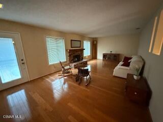 1457 Sycamore Drive Simi Valley, CA 93065 - Photo 5 of 8 a living room with furniture and a wooden floor