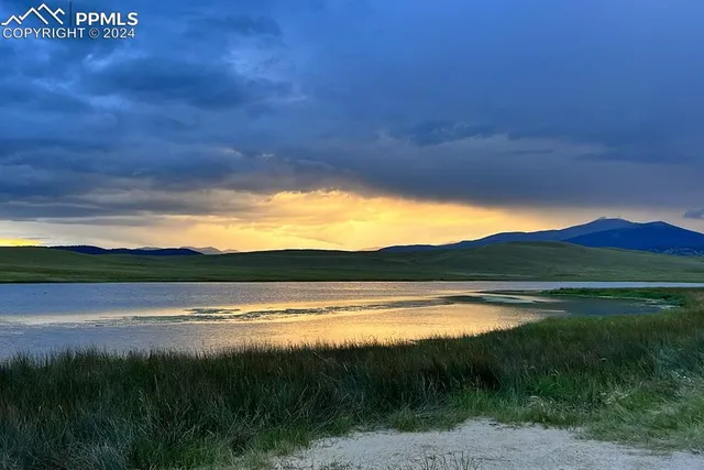 a view of lake with mountain