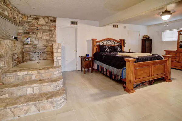 a bedroom with a bed and a cabinets
