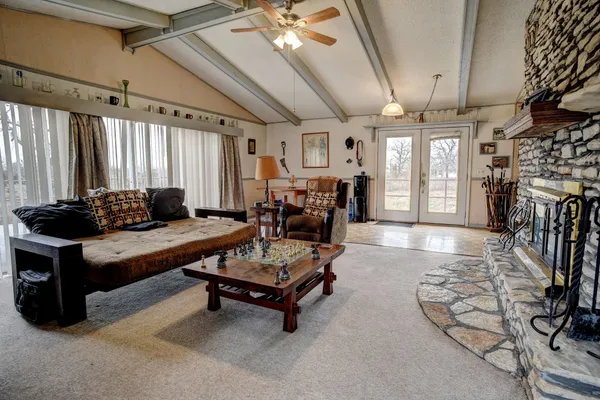 a living room with furniture and a fireplace