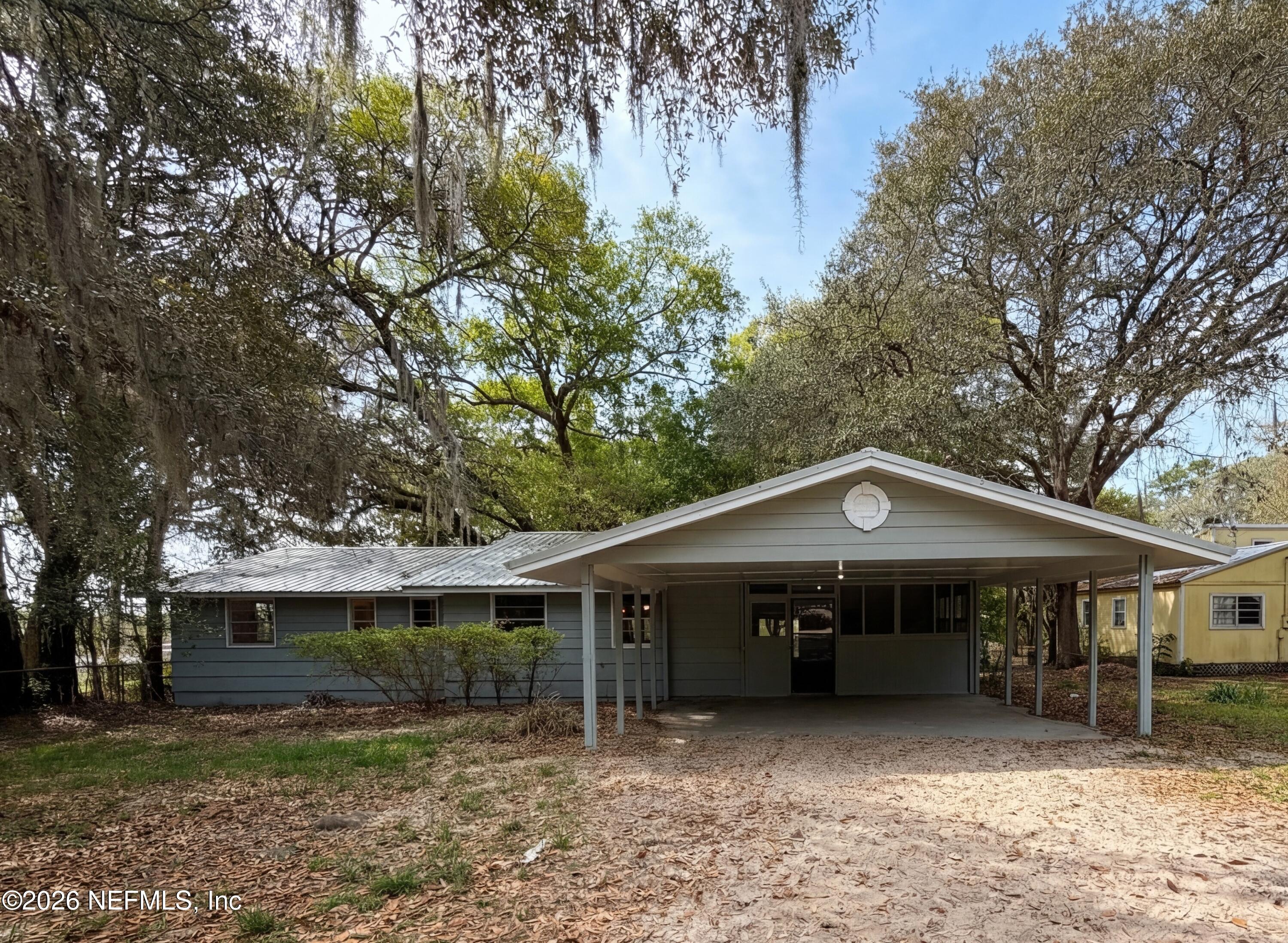 6917 Gatorbone Road Keystone Heights, FL 32656 - Photo 1 of 24 a house view with a garden space