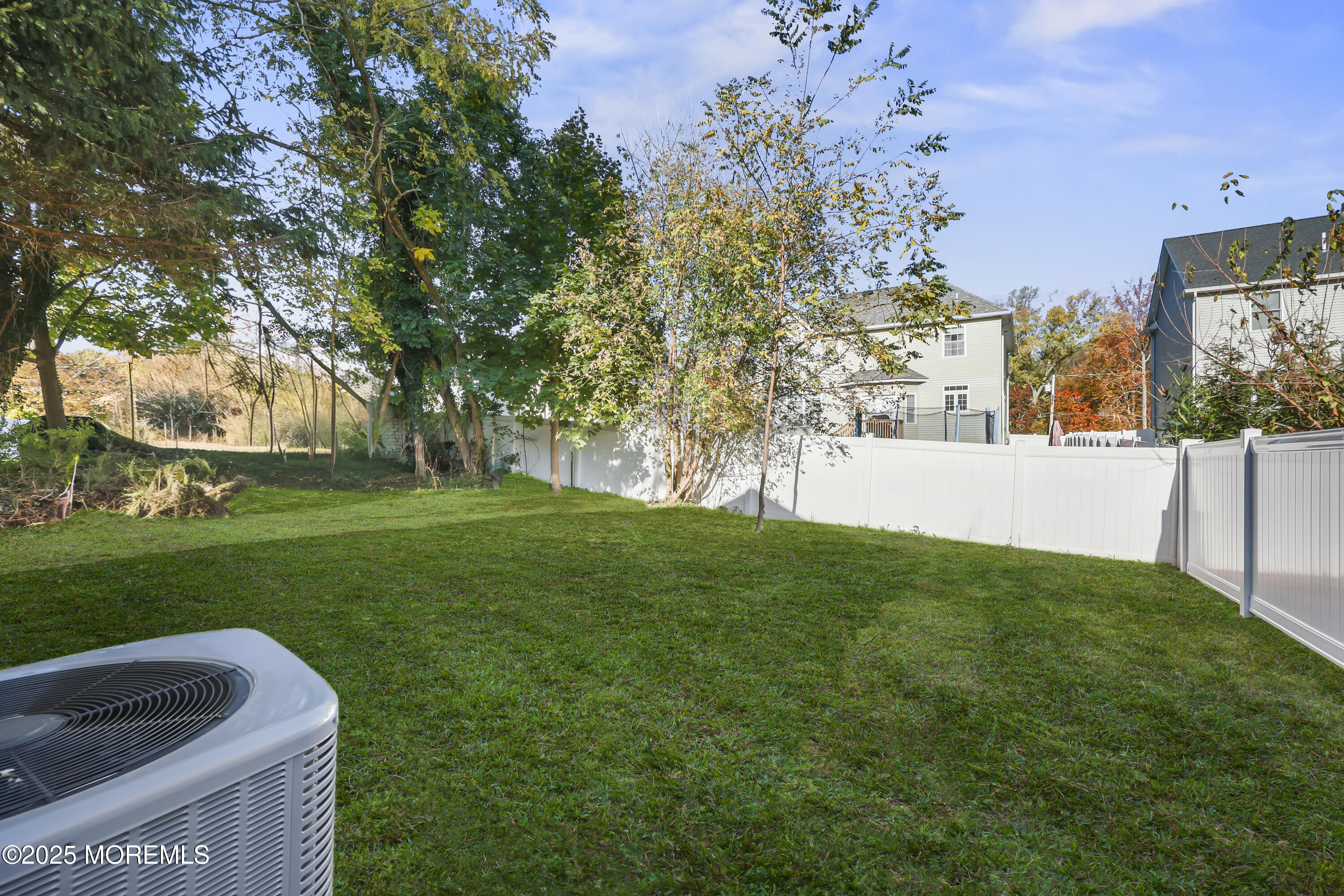 188 Texas Road Morganville, NJ 07751 - Photo 21 of 21 a view of yard with grass and trees