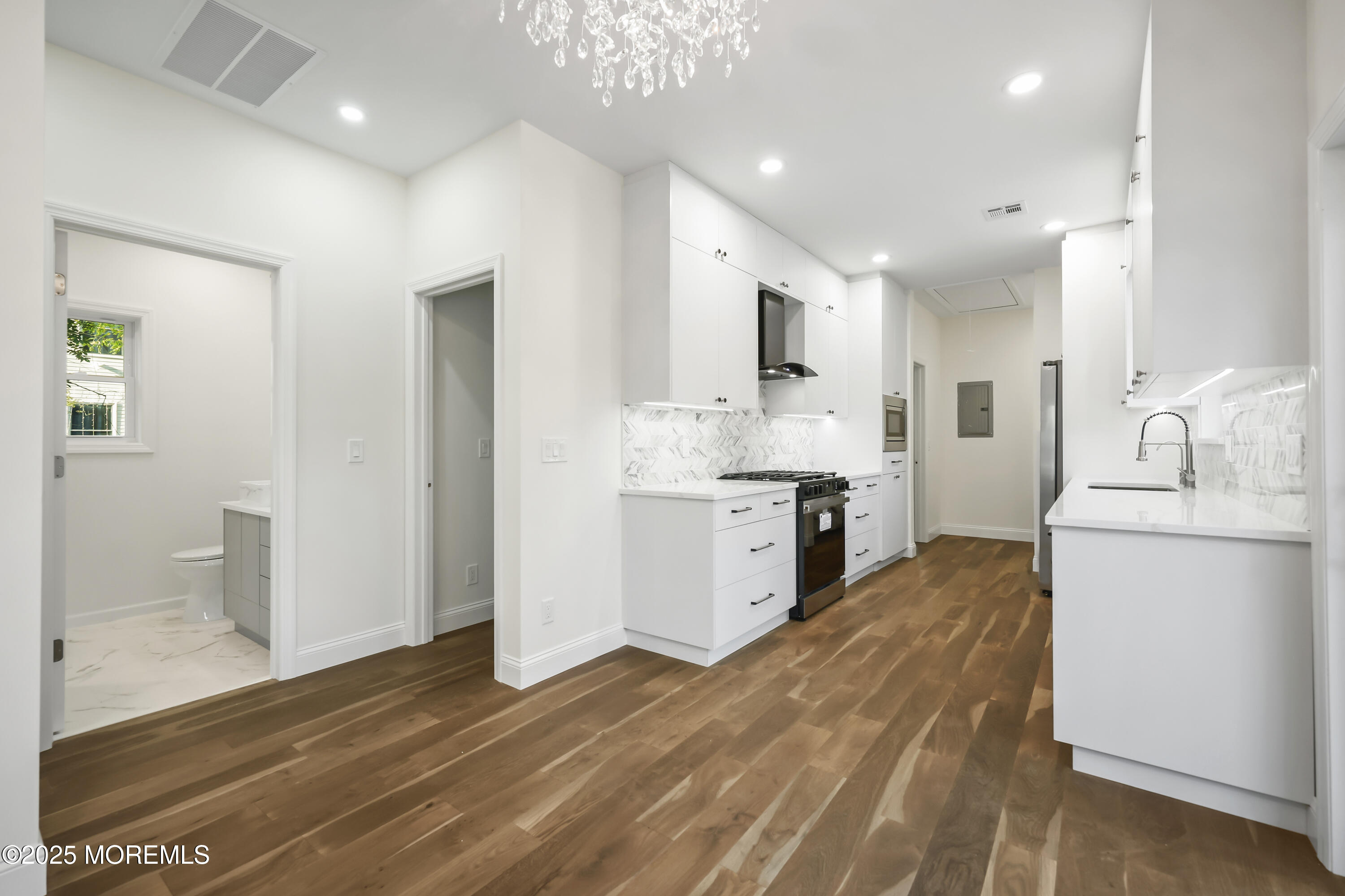 188 Texas Road Morganville, NJ 07751 - Photo 3 of 21 a large kitchen with kitchen island a sink stainless steel appliances and cabinets