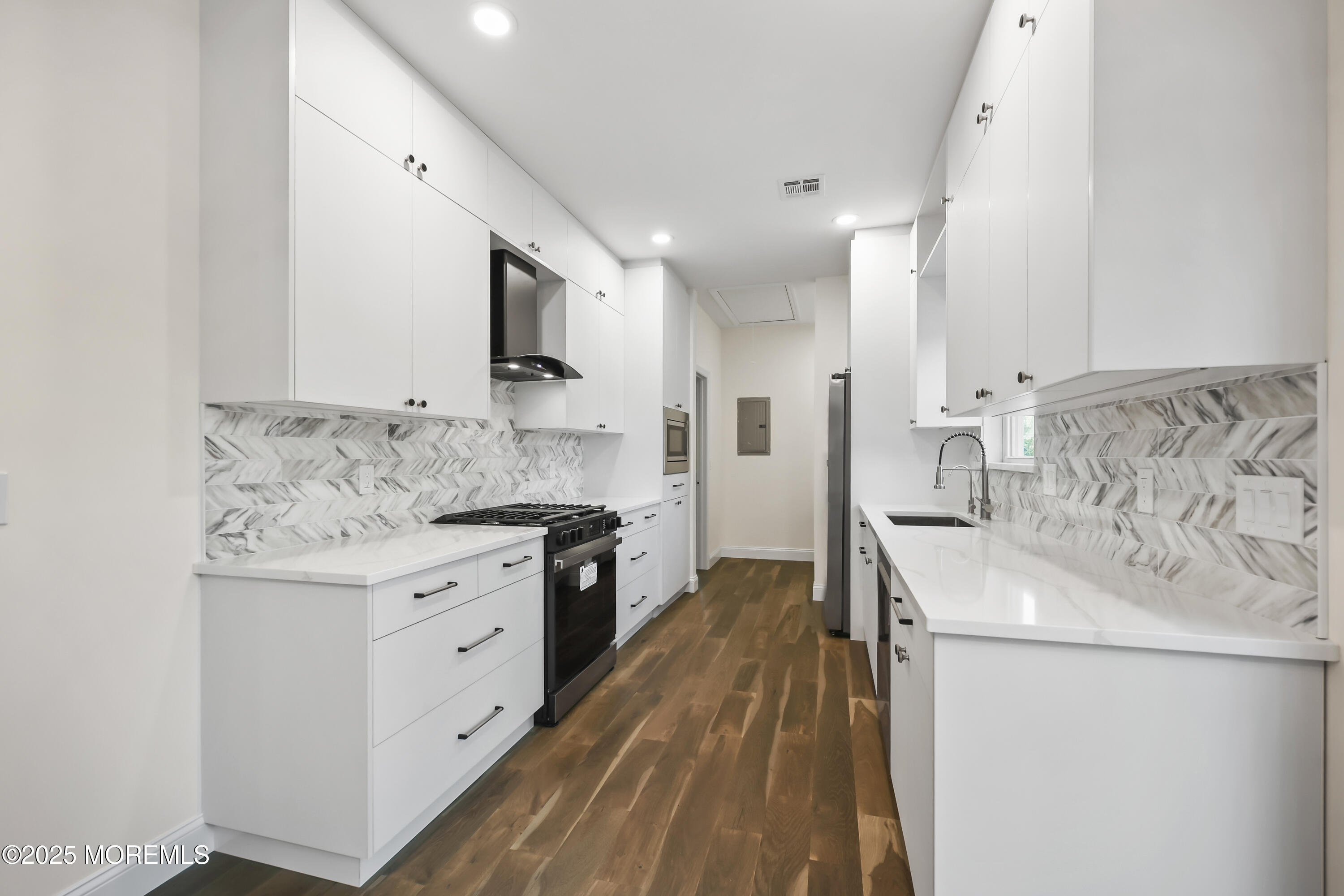 188 Texas Road Morganville, NJ 07751 - Photo 5 of 21 a kitchen with stainless steel appliances granite countertop a sink stove and refrigerator