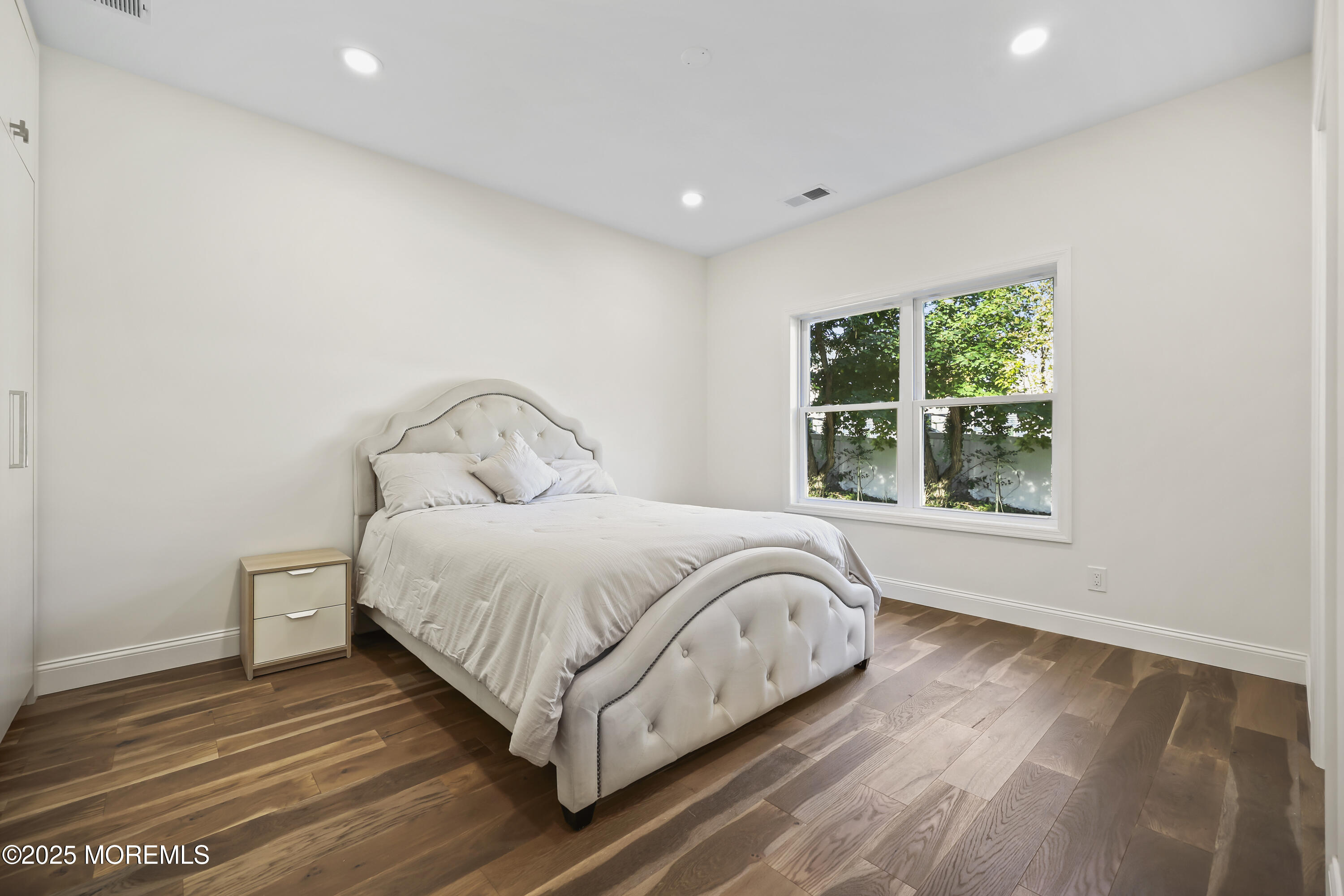 188 Texas Road Morganville, NJ 07751 - Photo 10 of 21 a bedroom with a bed and window