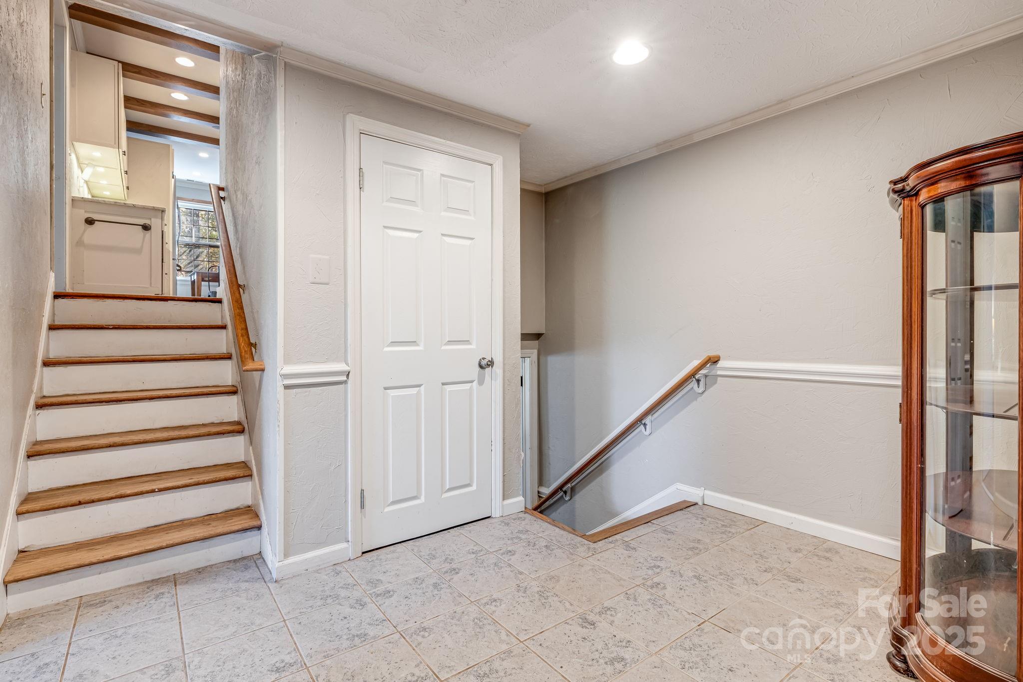 203 Davis Mountain Road Laurel Park, NC 28739 - Photo 21 of 37 a view of a hallway with staircase
