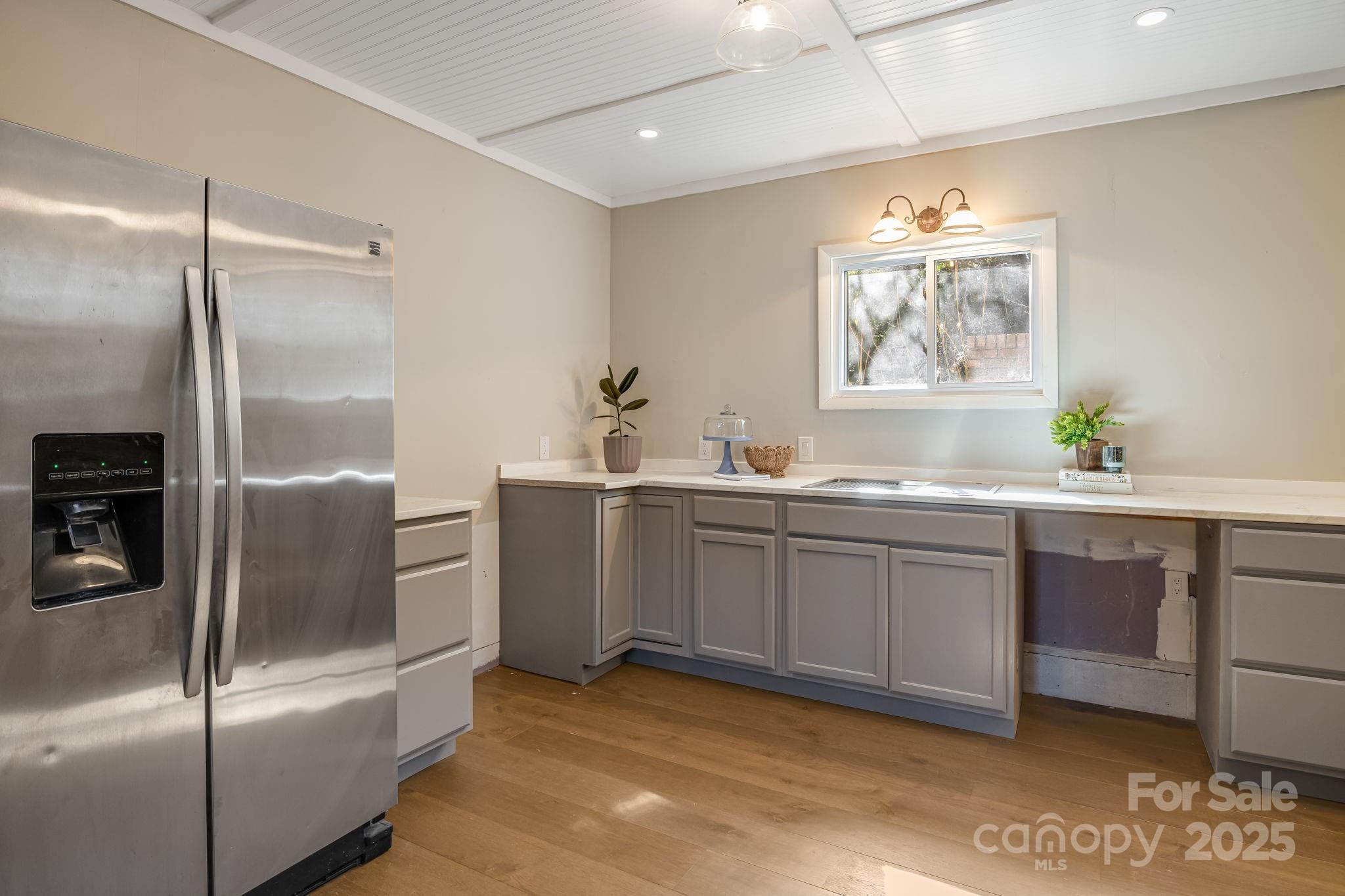 203 Davis Mountain Road Laurel Park, NC 28739 - Photo 27 of 37 a kitchen with stainless steel appliances granite countertop a refrigerator and a sink