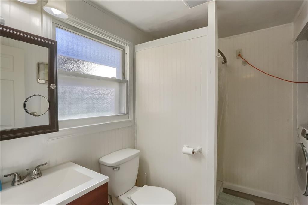 20 Deweyville Road McKees Rocks, PA 15136 - Photo 21 of 25 a bathroom with a toilet a sink and mirror