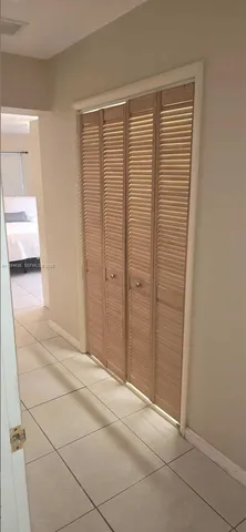 a room with a chair and a window