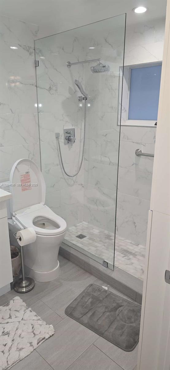 7160 West 10th Avenue Hialeah, FL 33014 - Photo 29 of 45 a bathroom with a toilet and a shower