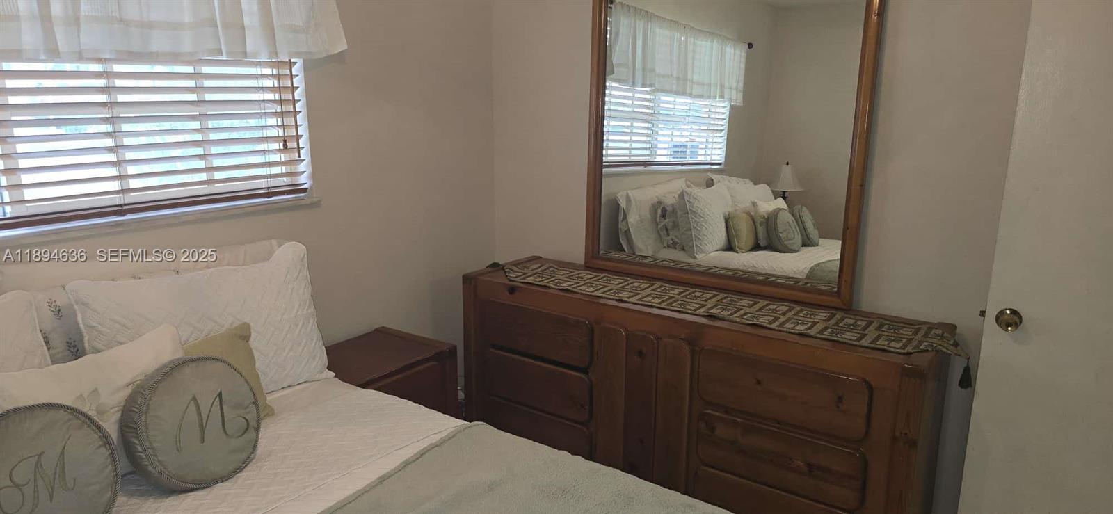 7160 West 10th Avenue Hialeah, FL 33014 - Photo 31 of 45 a living room with furniture and a window