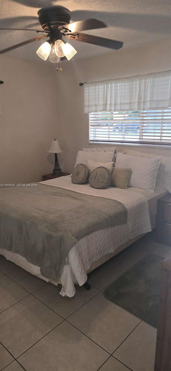 7160 West 10th Avenue Hialeah, FL 33014 - Photo 33 of 45 a living room with furniture and a chandelier