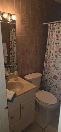 a bathroom with a sink and a stove