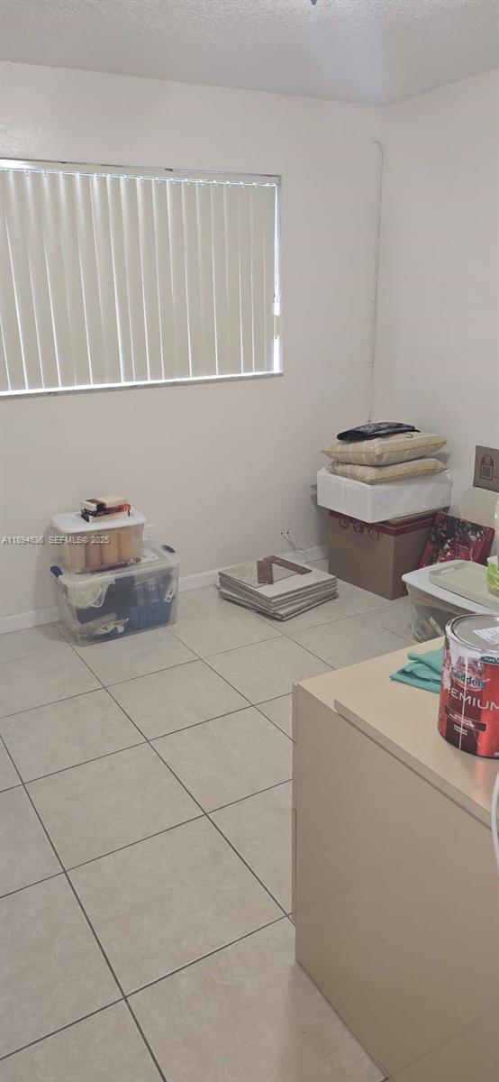 7160 West 10th Avenue Hialeah, FL 33014 - Photo 38 of 45 a bathroom with a sink and a stove