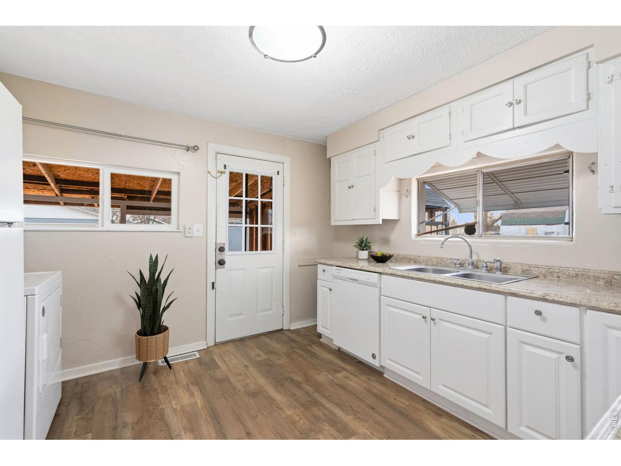 1416 6th Street Greeley, CO 80631 - Photo 13 of 50 a kitchen with sink and cabinets