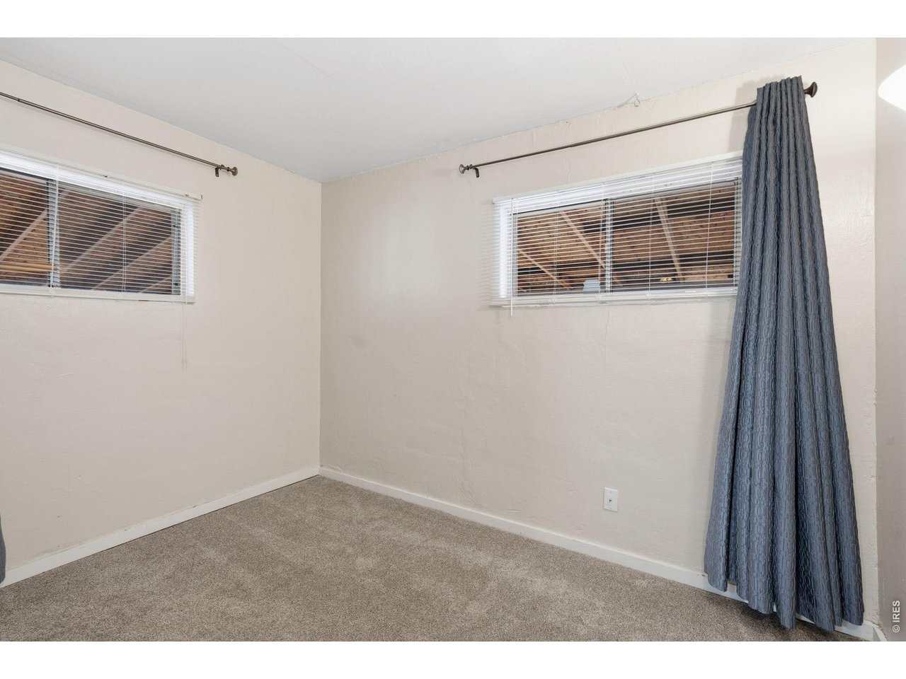 1416 6th Street Greeley, CO 80631 - Photo 20 of 50 a room that has a window in it