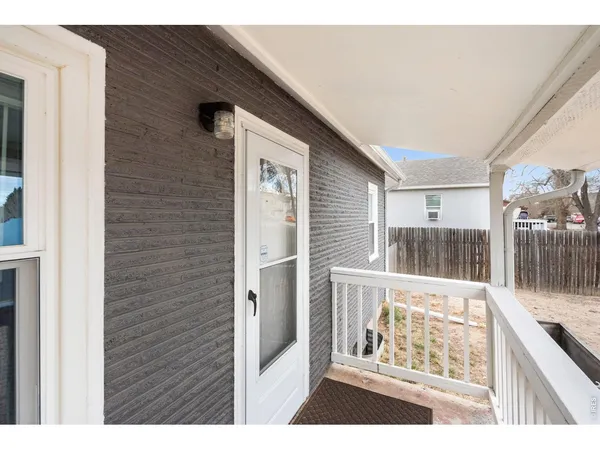 a view of a wooden floor and a large window