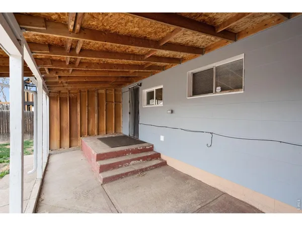 a bedroom with a bed and a ceiling fan