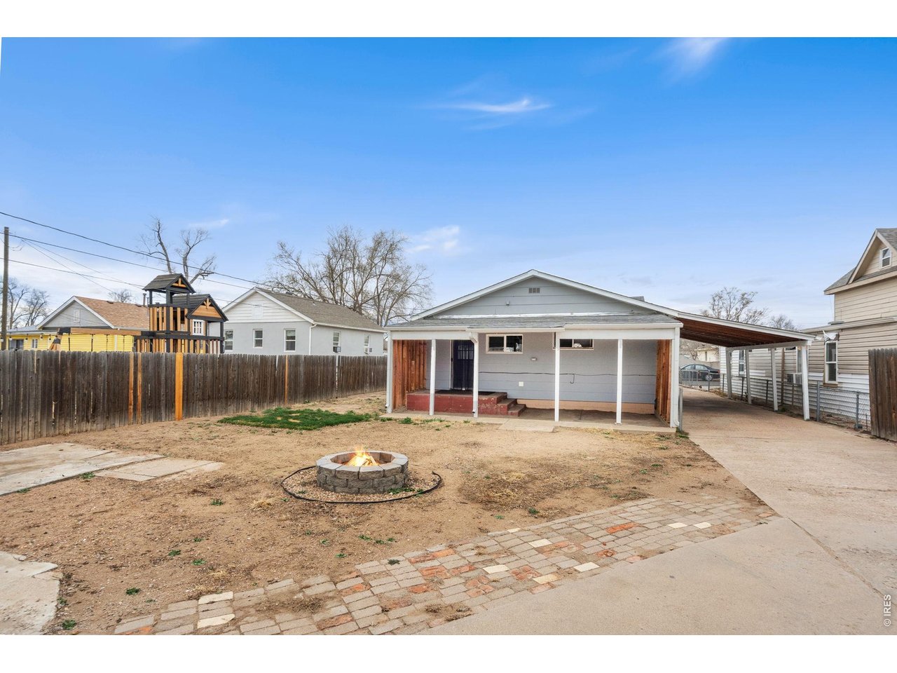 1416 6th Street Greeley, CO 80631 - Photo 27 of 50 a view of a house with backyard and sitting area