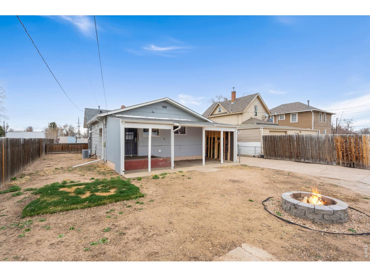 1416 6th Street Greeley, CO 80631 - Photo 28 of 50 a view of a house with backyard and wooden fence