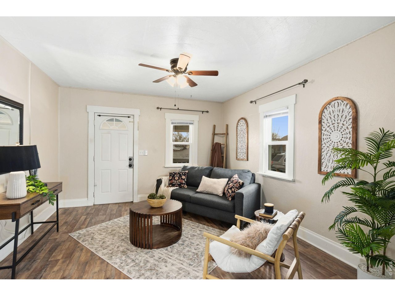 1416 6th Street Greeley, CO 80631 - Photo 5 of 50 a living room with furniture potted plant and a window