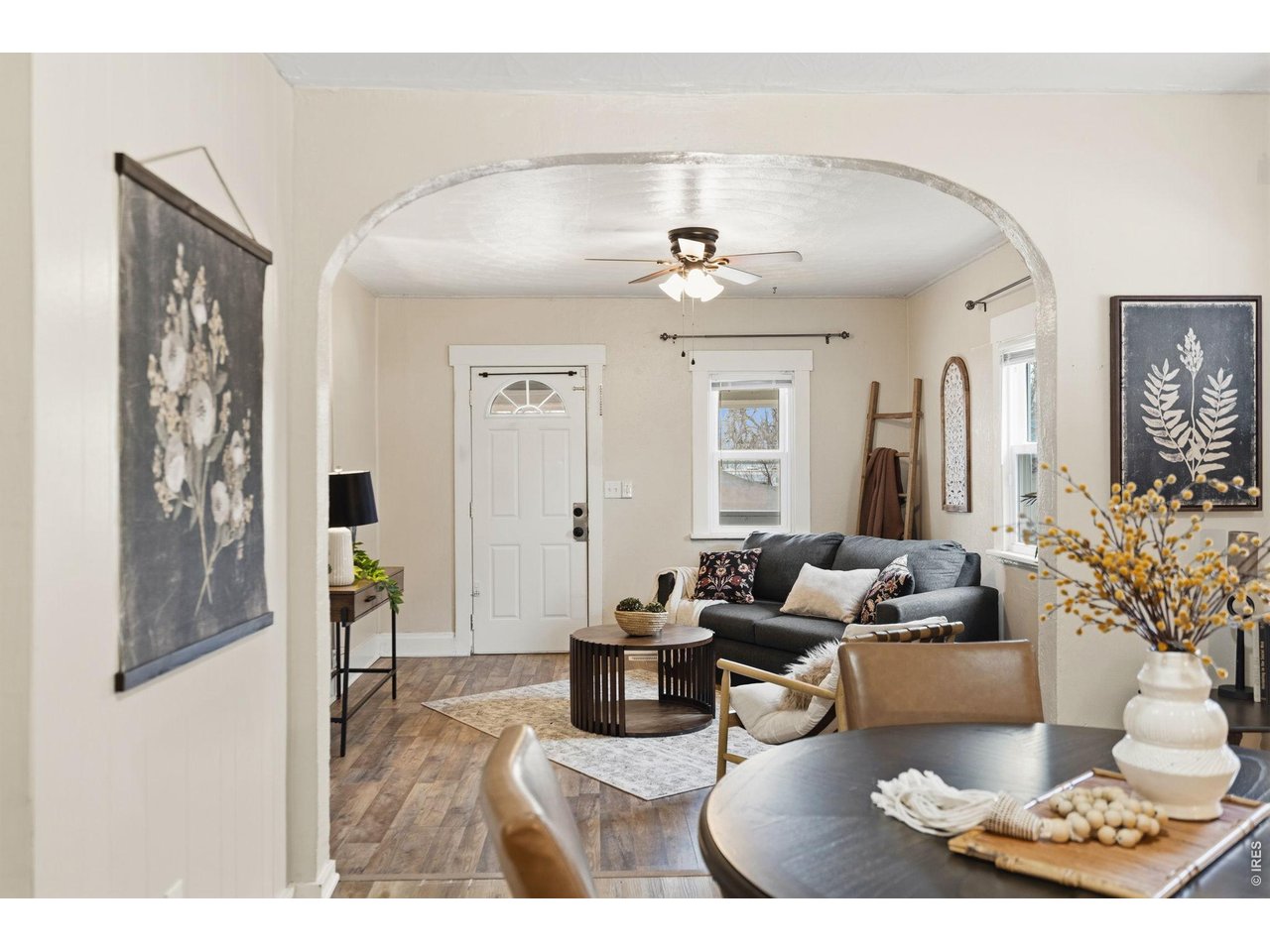 1416 6th Street Greeley, CO 80631 - Photo 7 of 50 a living room with furniture and a chandelier