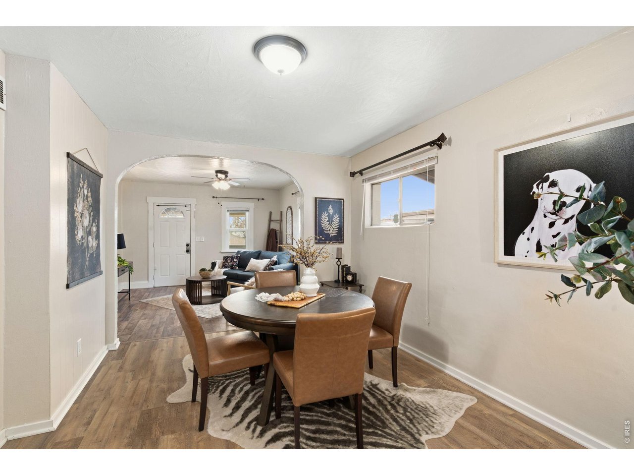 1416 6th Street Greeley, CO 80631 - Photo 9 of 50 a view of a dining room with furniture and wooden floor