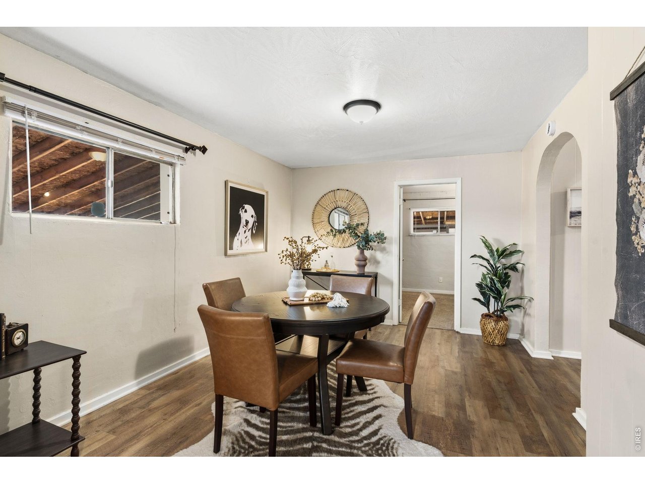 1416 6th Street Greeley, CO 80631 - Photo 10 of 50 a view of a dining room with furniture and wooden floor