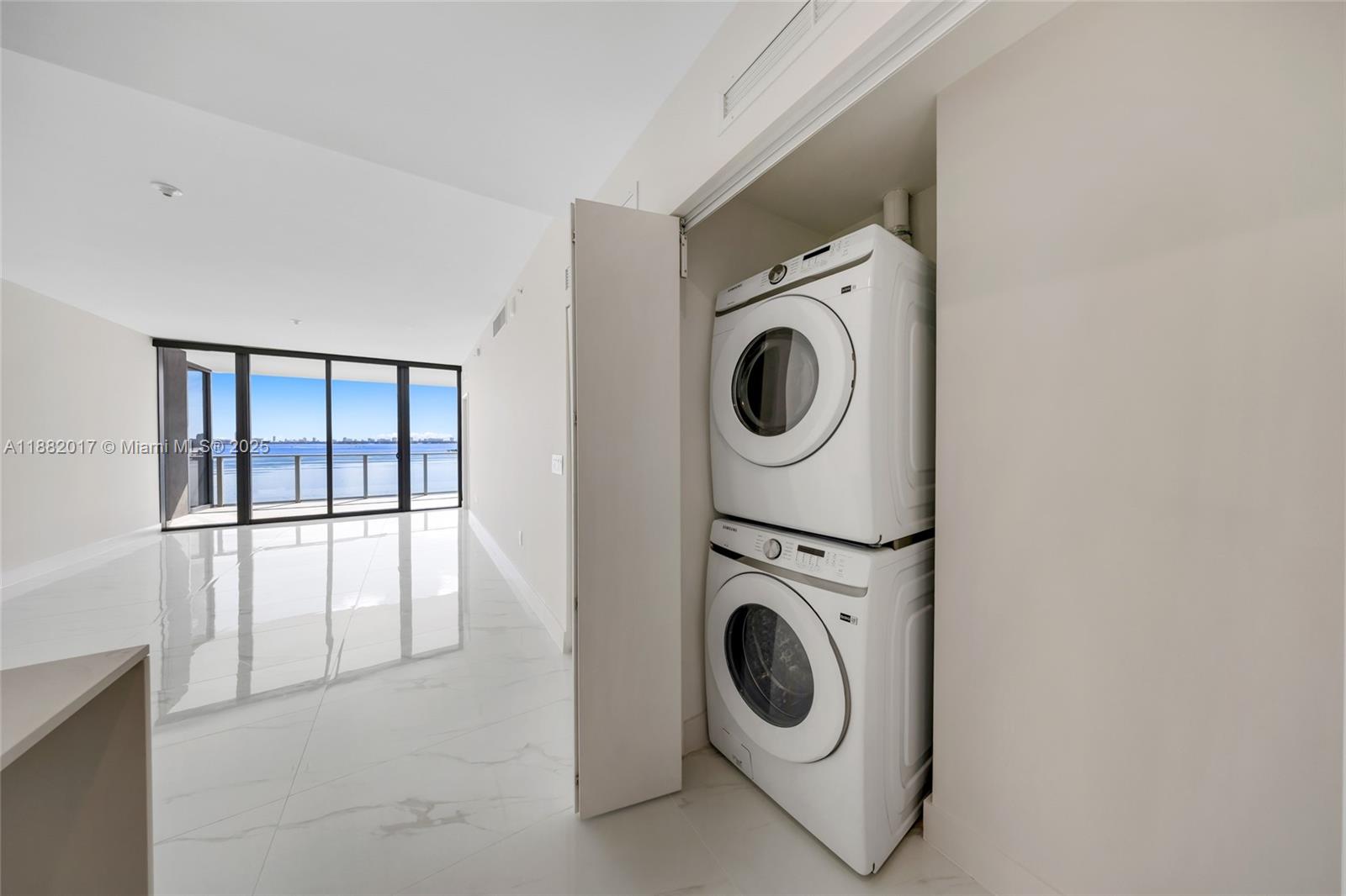 700 Northeast 24th Street, Unit 502 Miami, FL 33137 - Photo 16 of 25 a utility room with dryer and washer