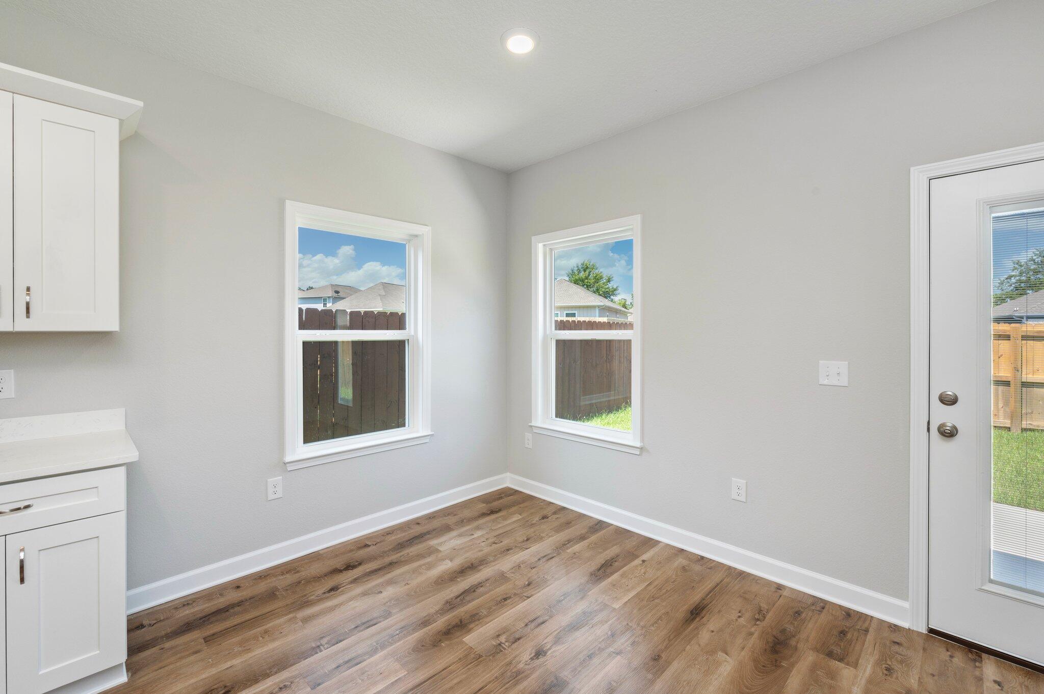 73 Lafayette Creek Freeport, FL 32439 - Photo 14 of 38 a view of an empty room with a window and wooden floor