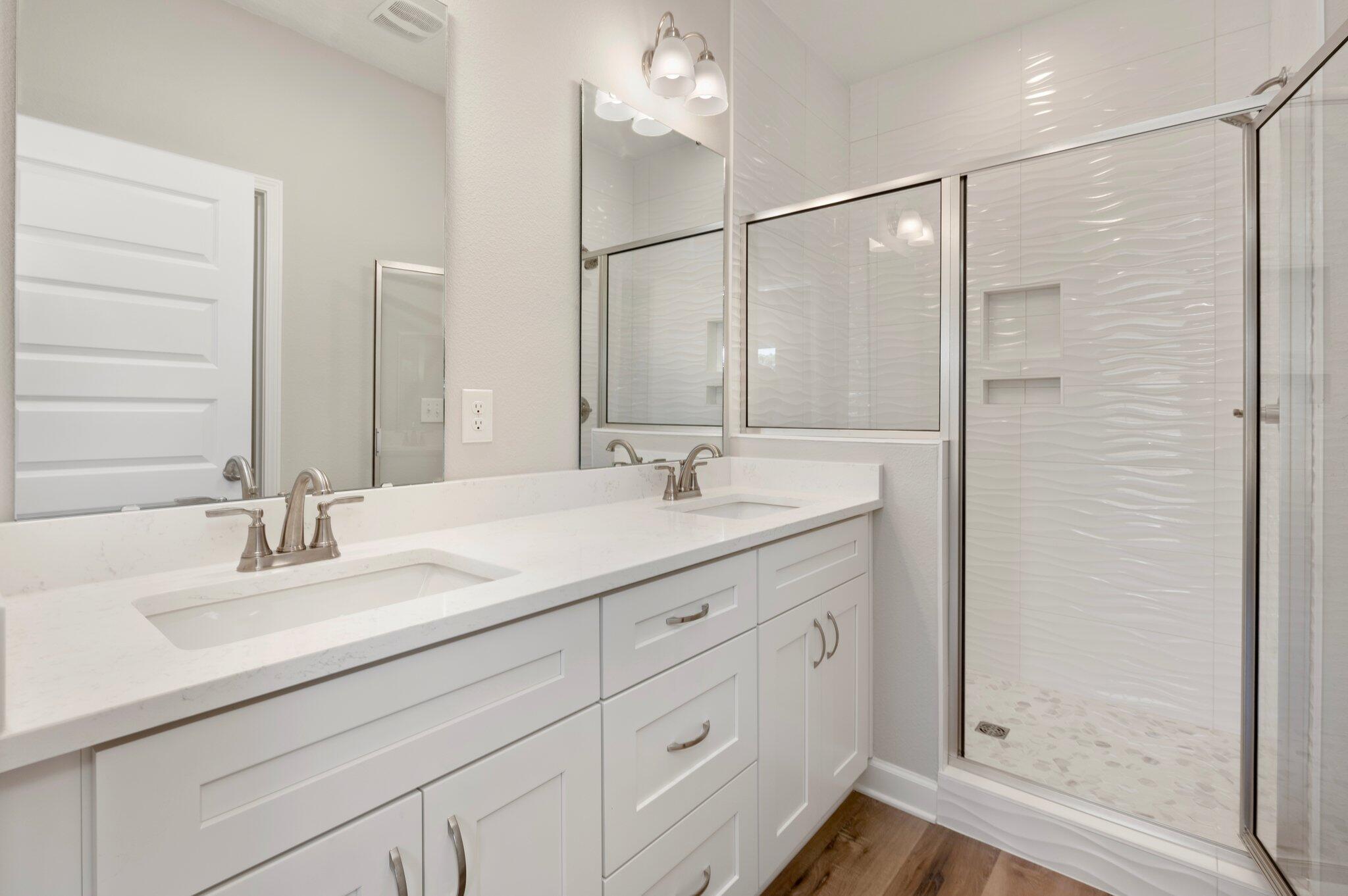 73 Lafayette Creek Freeport, FL 32439 - Photo 18 of 38 a bathroom with double vanity sink and a mirror