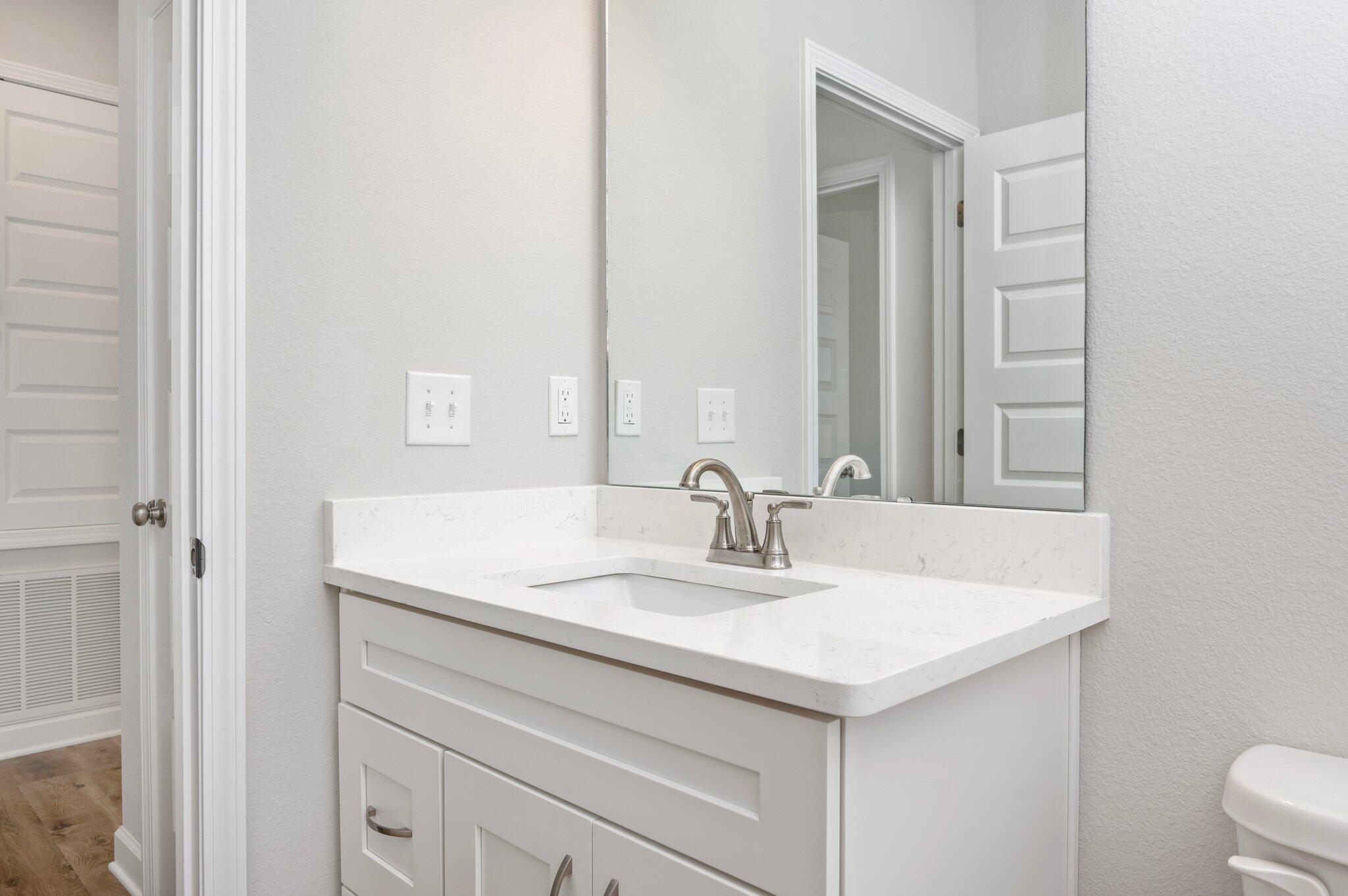 73 Lafayette Creek Freeport, FL 32439 - Photo 25 of 38 a bathroom with a sink and a mirror