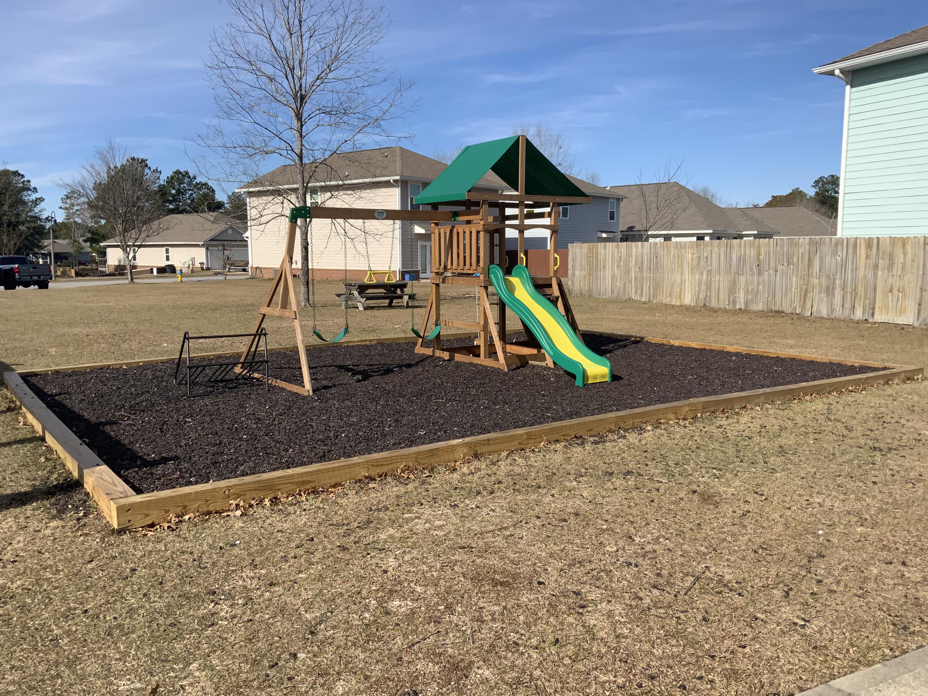 73 Lafayette Creek Freeport, FL 32439 - Photo 35 of 38 a view of outdoor space with playground and green space