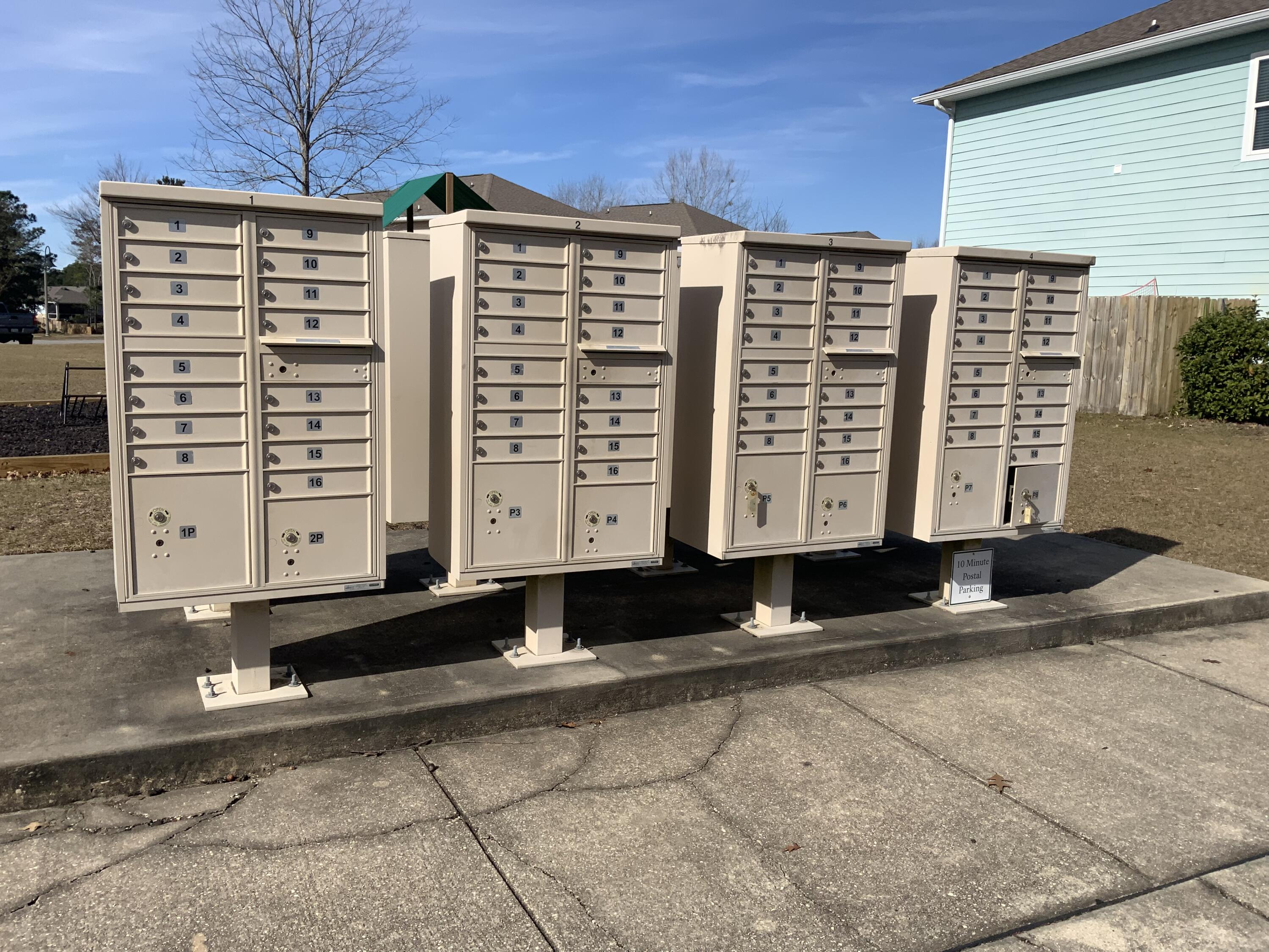73 Lafayette Creek Freeport, FL 32439 - Photo 36 of 38 a front view of a building with a large tree