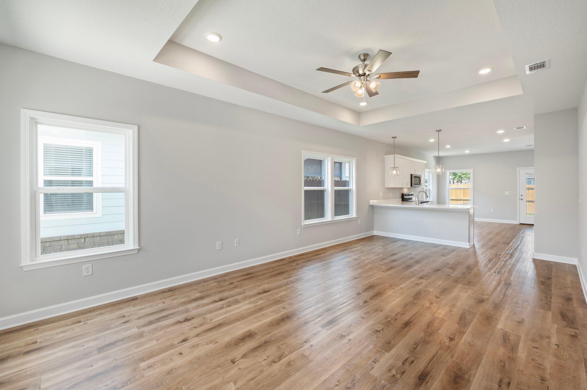 73 Lafayette Creek Freeport, FL 32439 - Photo 5 of 38 a view of an empty room with wooden floor and a window