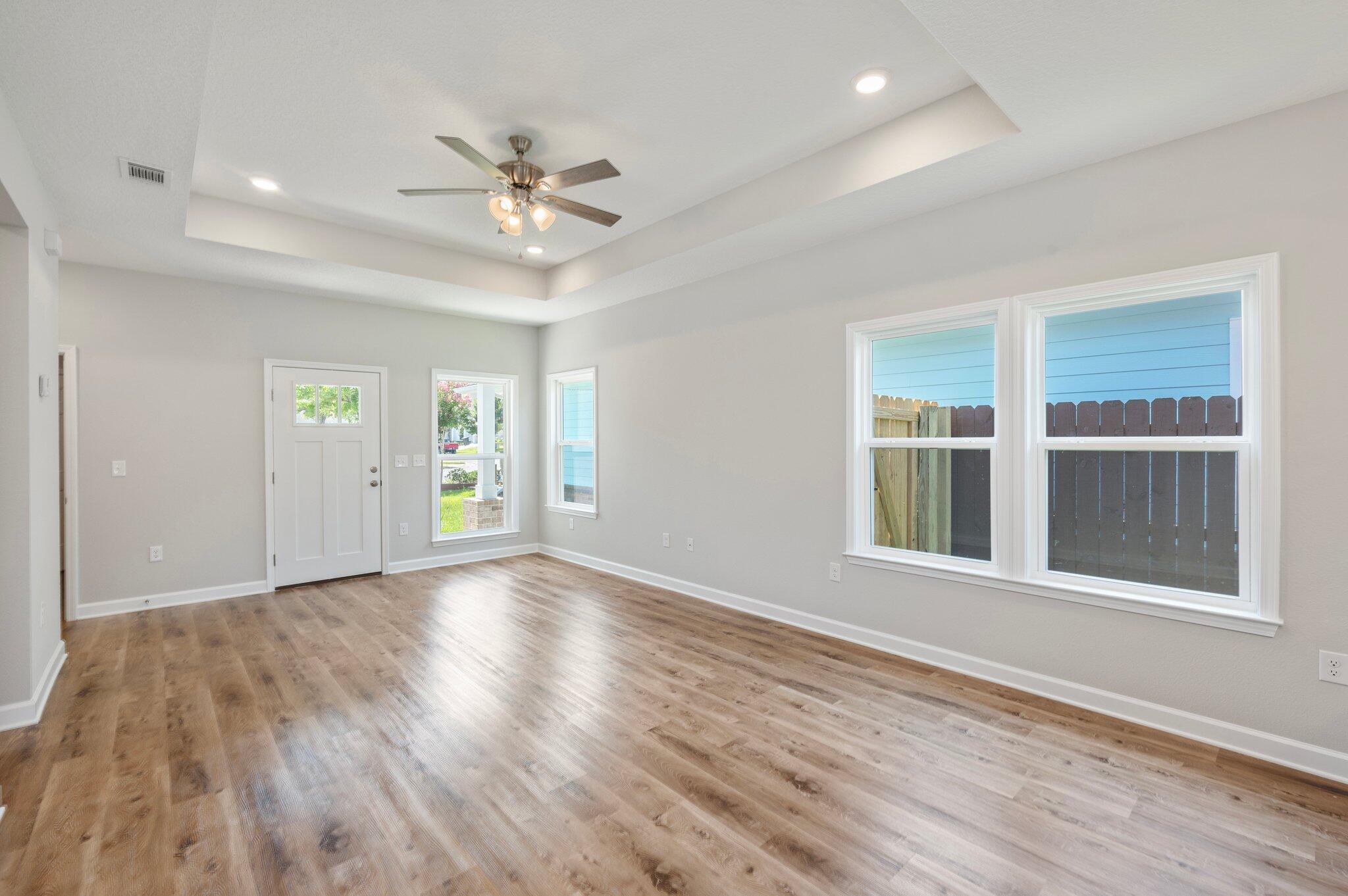 73 Lafayette Creek Freeport, FL 32439 - Photo 6 of 38 a view of an empty room with a window and wooden floor