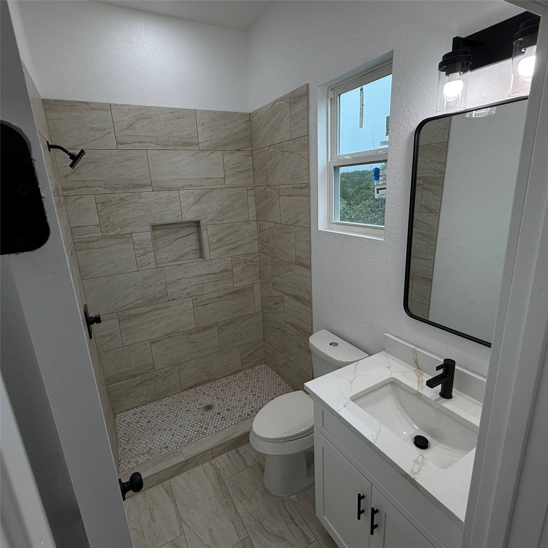 118 Crazy Cross Road Wimberley, TX 78676 - Photo 16 of 18 a bathroom with a sink a toilet and shower