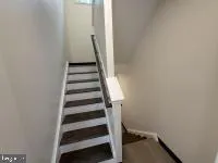 a view of a hallway with staircase