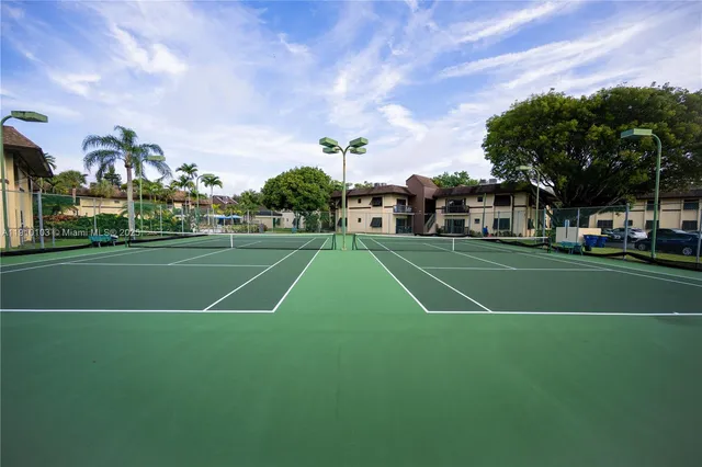 a view of a basket ball ground and trees