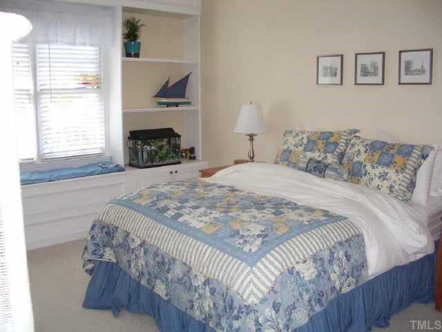 2928 Englefield Drive Raleigh, NC 27615 - Photo 5 of 9 A tranquil master suite features a walk in closet, double vanity, separate tub and shower. The built in bookcases and storage bench make this home feel very custom for you! Other