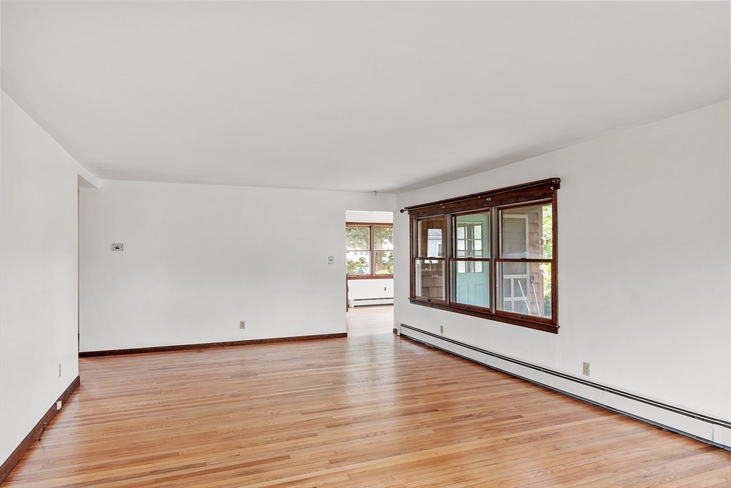4 22nd Street Wareham, MA 02558 - Photo 12 of 22 an empty room with wooden floor and windows